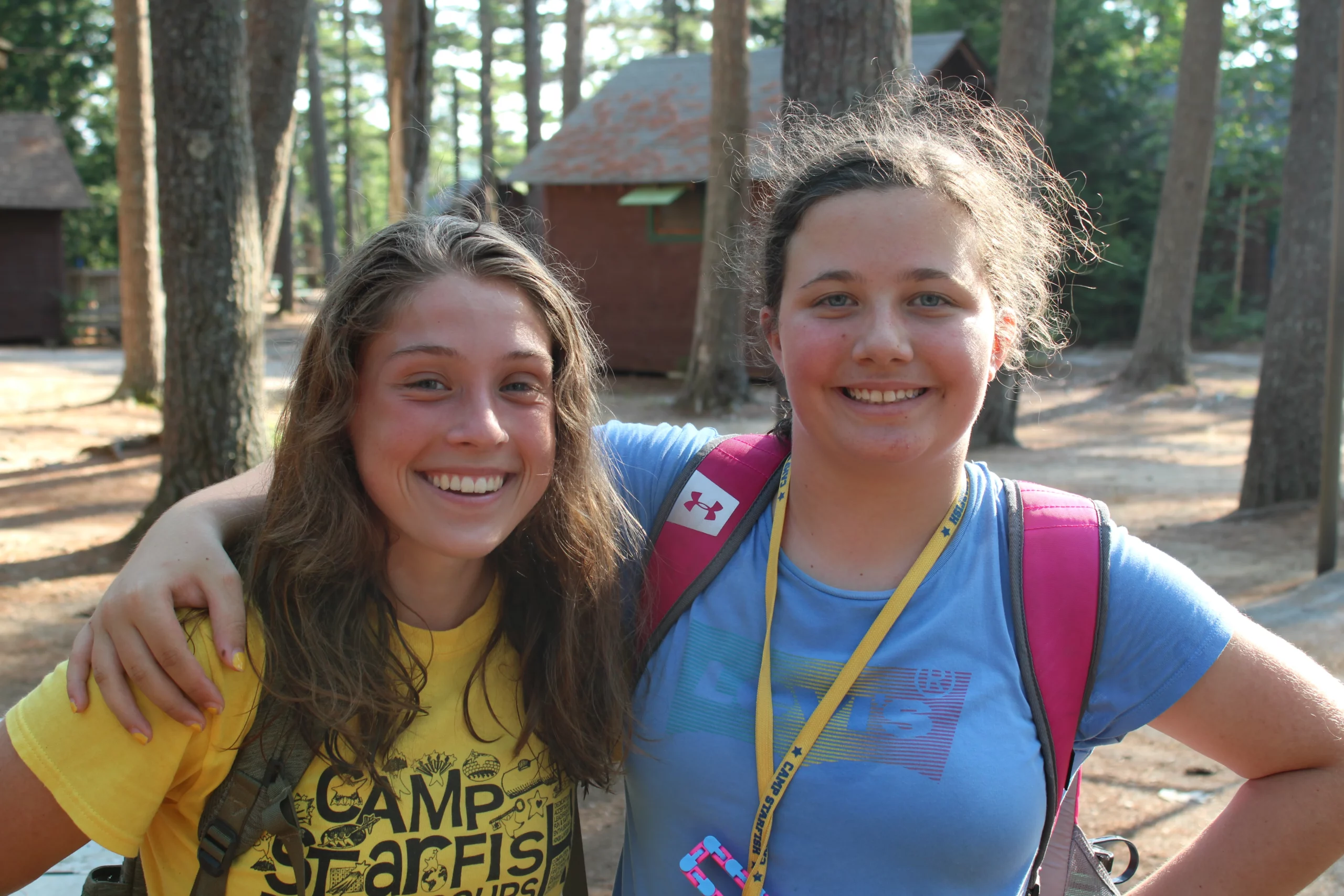 Smiling Camp Counselor and camper teen at Camp Starfish