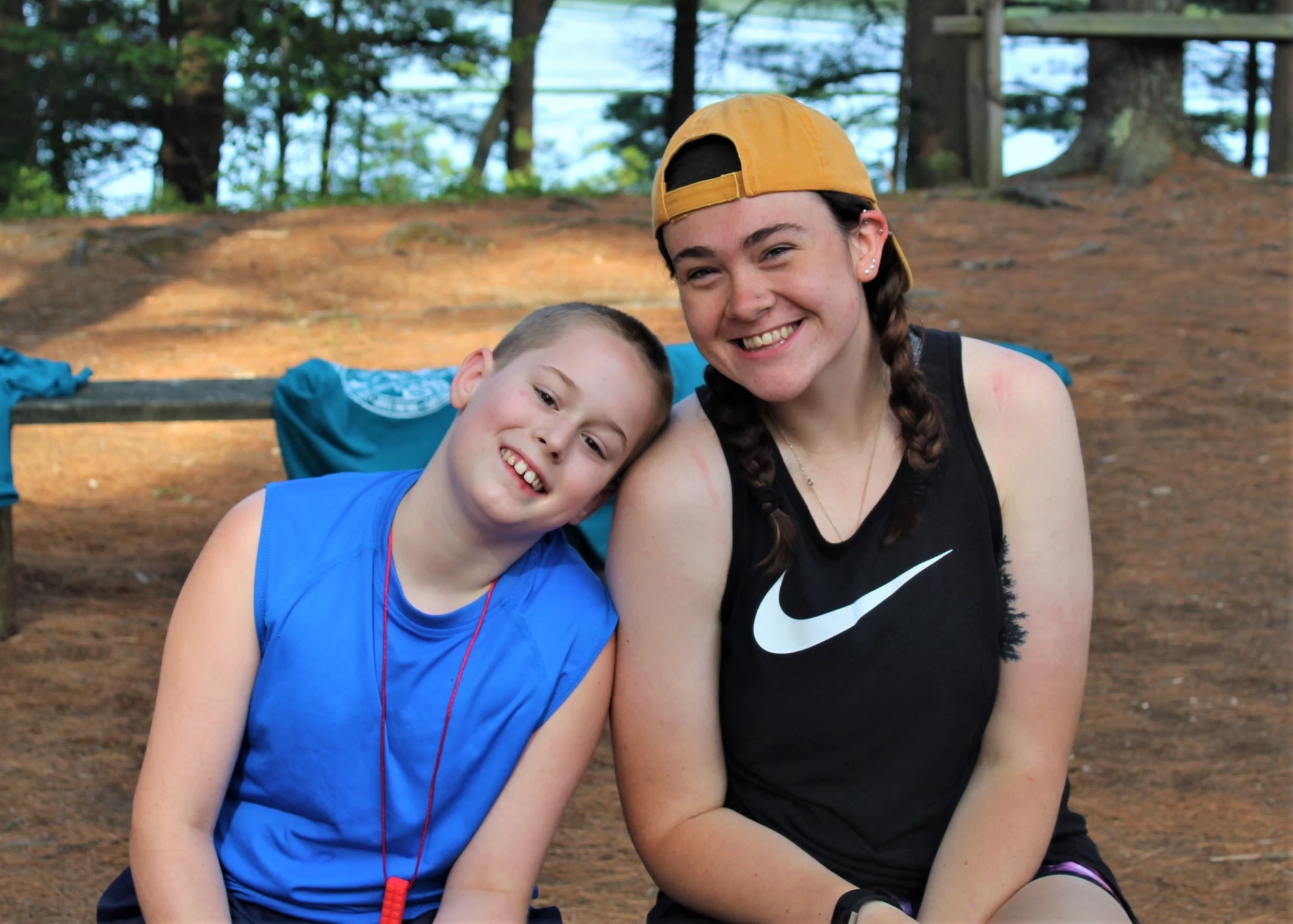 Smiling Camp Counselor and camper teen at Camp Starfish