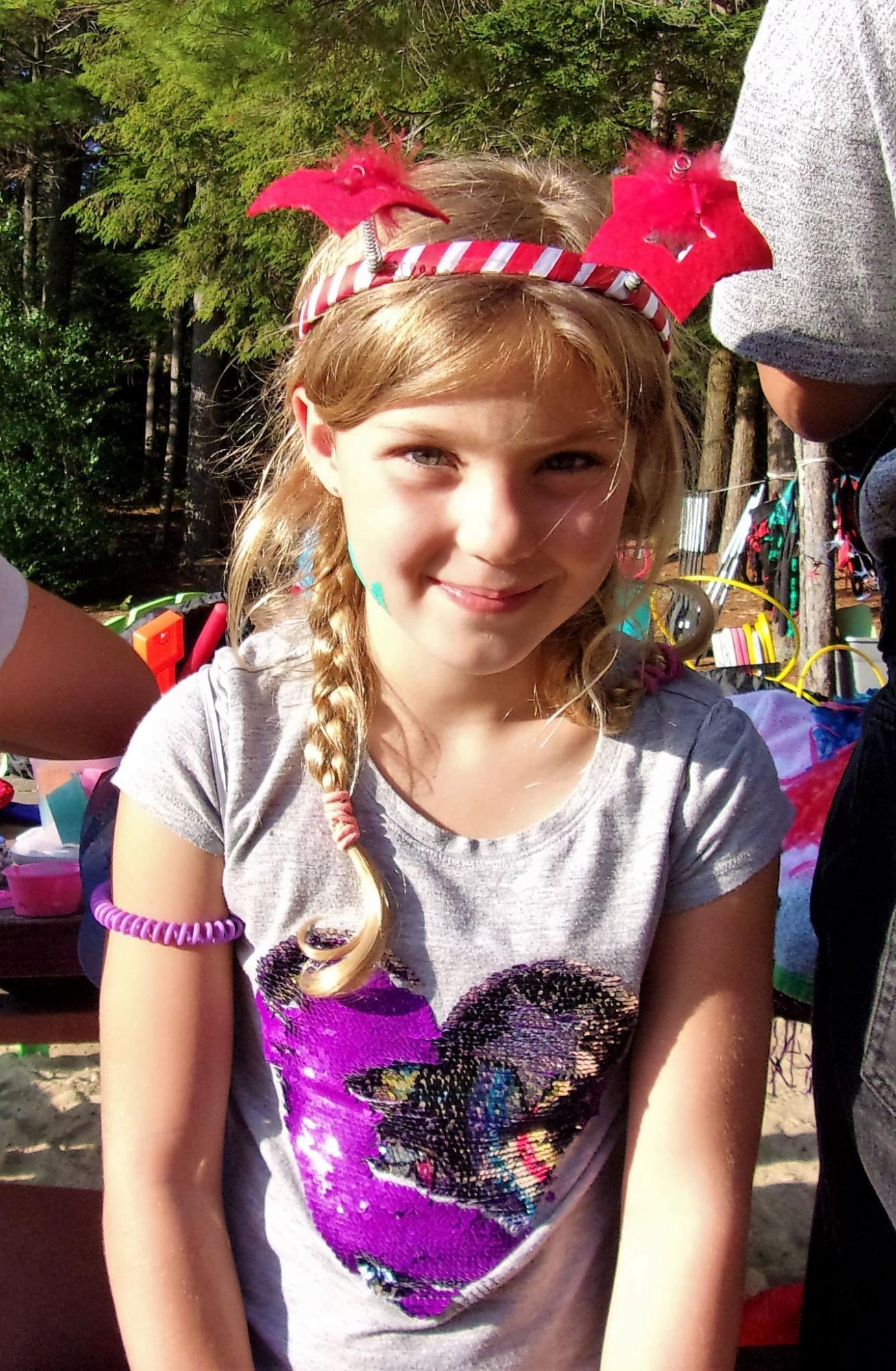 Camper girl smiling at camera at camp starfish