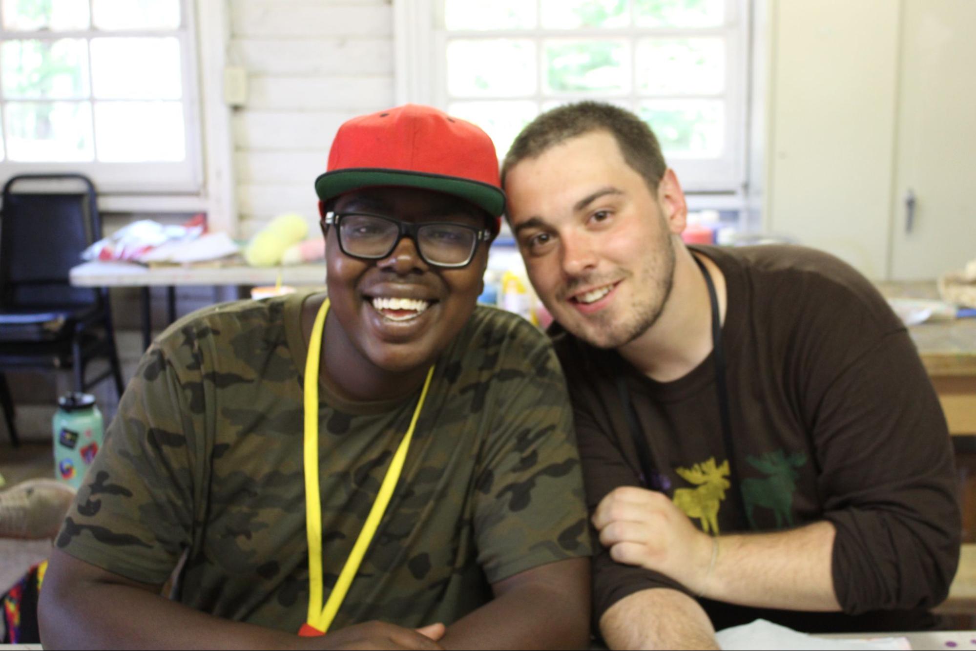 Smiling Camp Counselor and camper teen at Camp Starfish