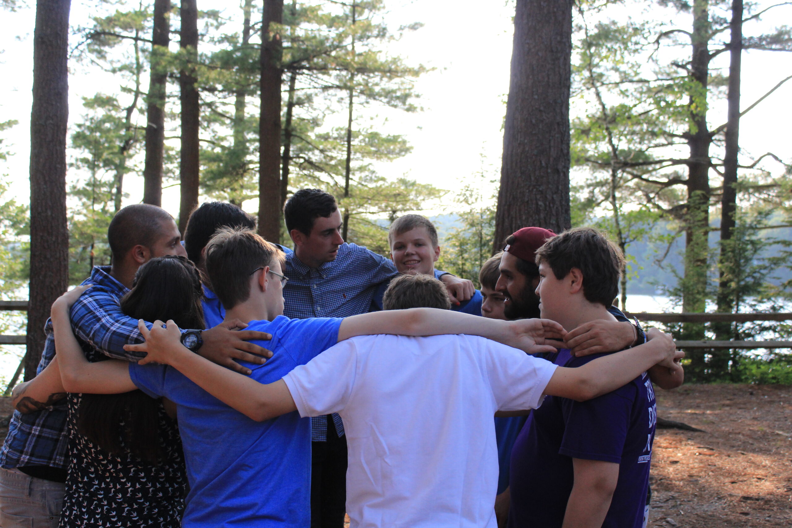 Group of boys in a group huddle at Camp Starfish